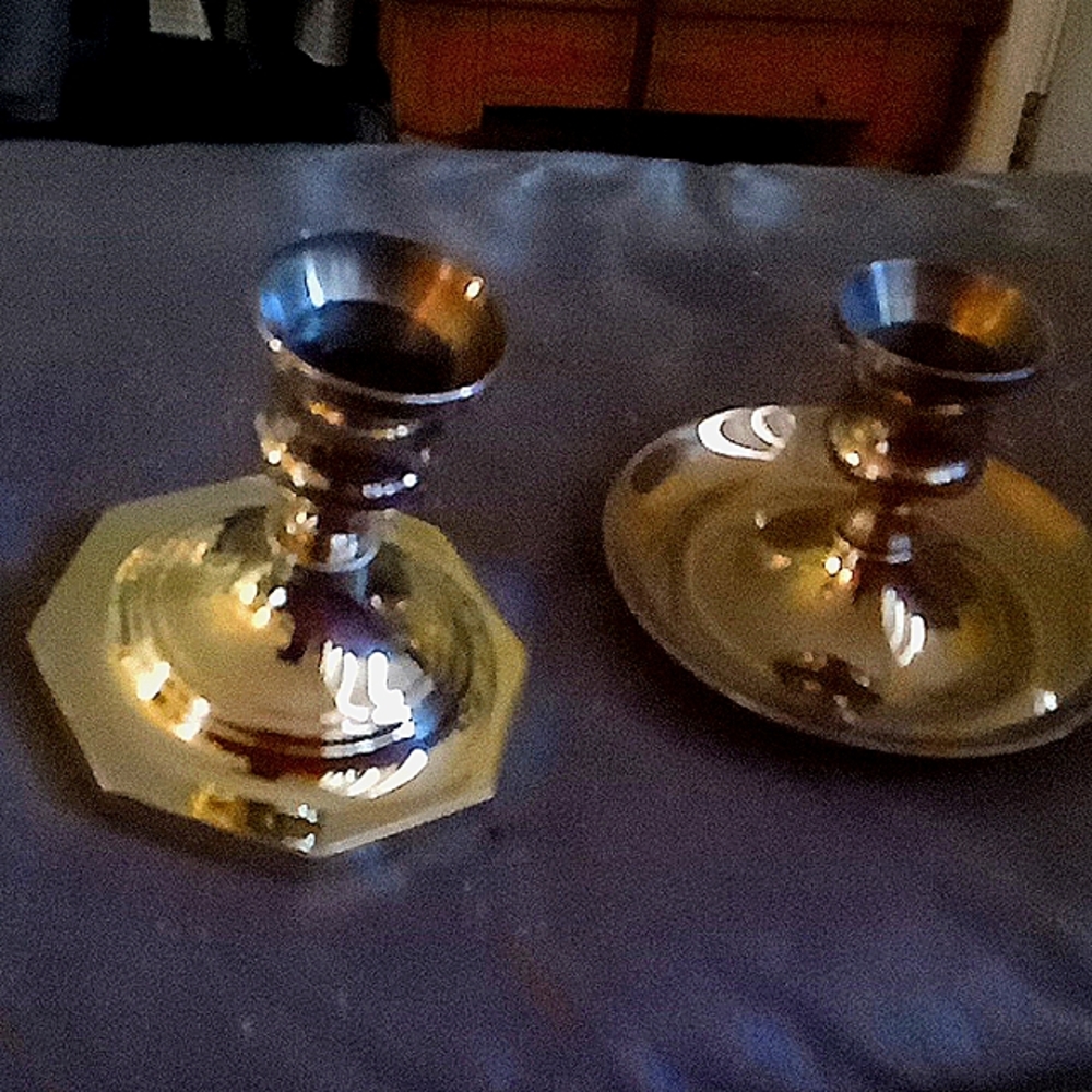 Two brass candle holders very nice well made and beautiful!